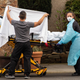 Healthcare workers transport a coronavirus patient in Kirkland, Washington, a suburb of Seattle.
